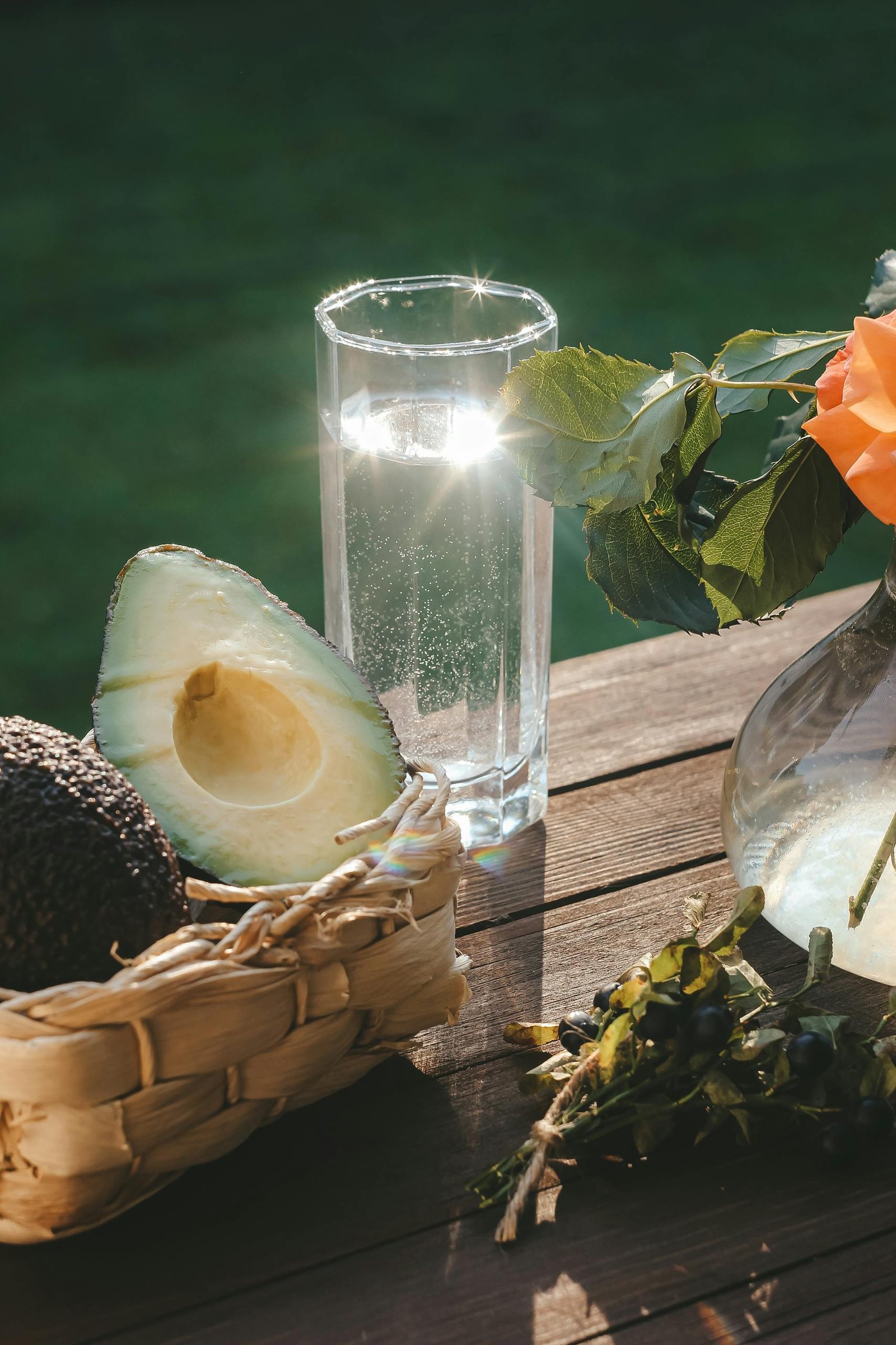 Avocado Fruit in a Basket Beside a Drink