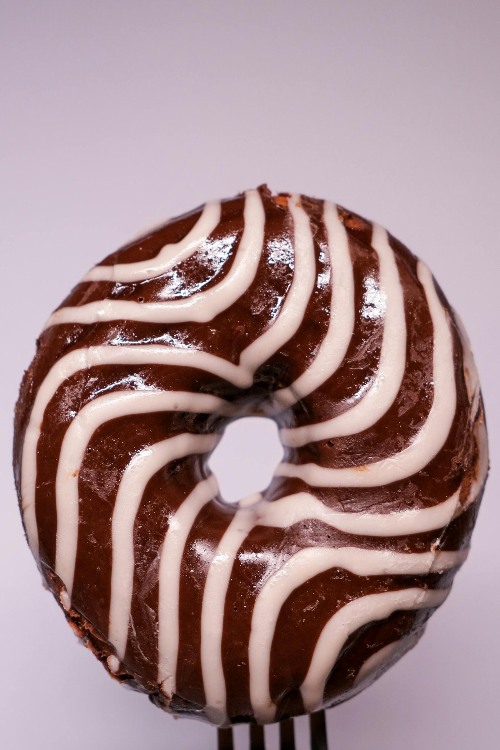 Delicious glazed doughnut against gray background