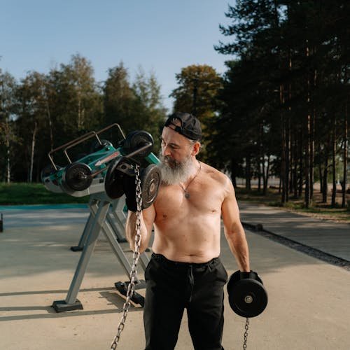 A Man Lifting Dumbbells