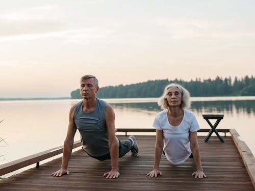 An Elderly Couple Exercising Together